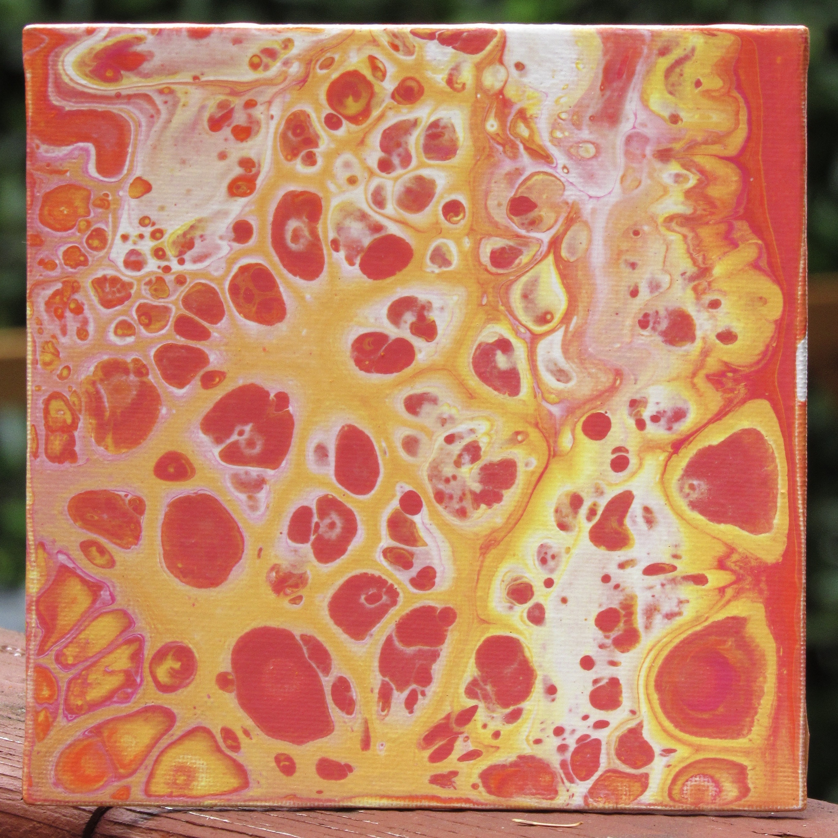 Orange acrylic pour painting